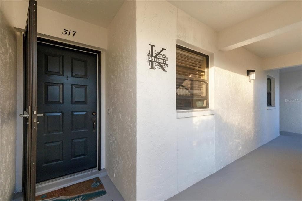 1100 CAPRI ISLES BOULEVARD UNIT 317 - Interior/Exterior Photo 3 - VENICE, FL