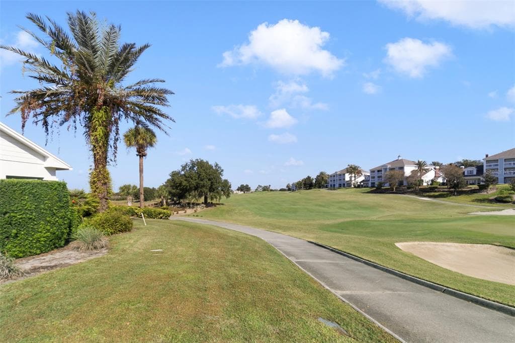 1591 HERITAGE CROSSING COURT UNIT 101 - Interior/Exterior Photo 3 - REUNION, FL