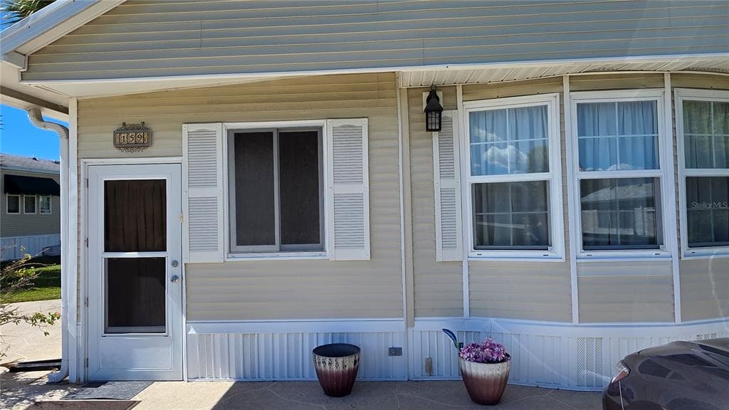 1674 UNIVERSITY PKWY LOT 159 - Interior/Exterior Photo 2 - SARASOTA, FL