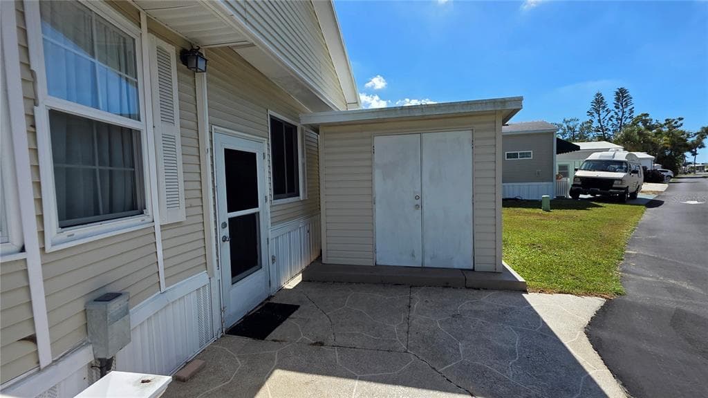 1674 UNIVERSITY PKWY LOT 159 - Interior/Exterior Photo 4 - SARASOTA, FL