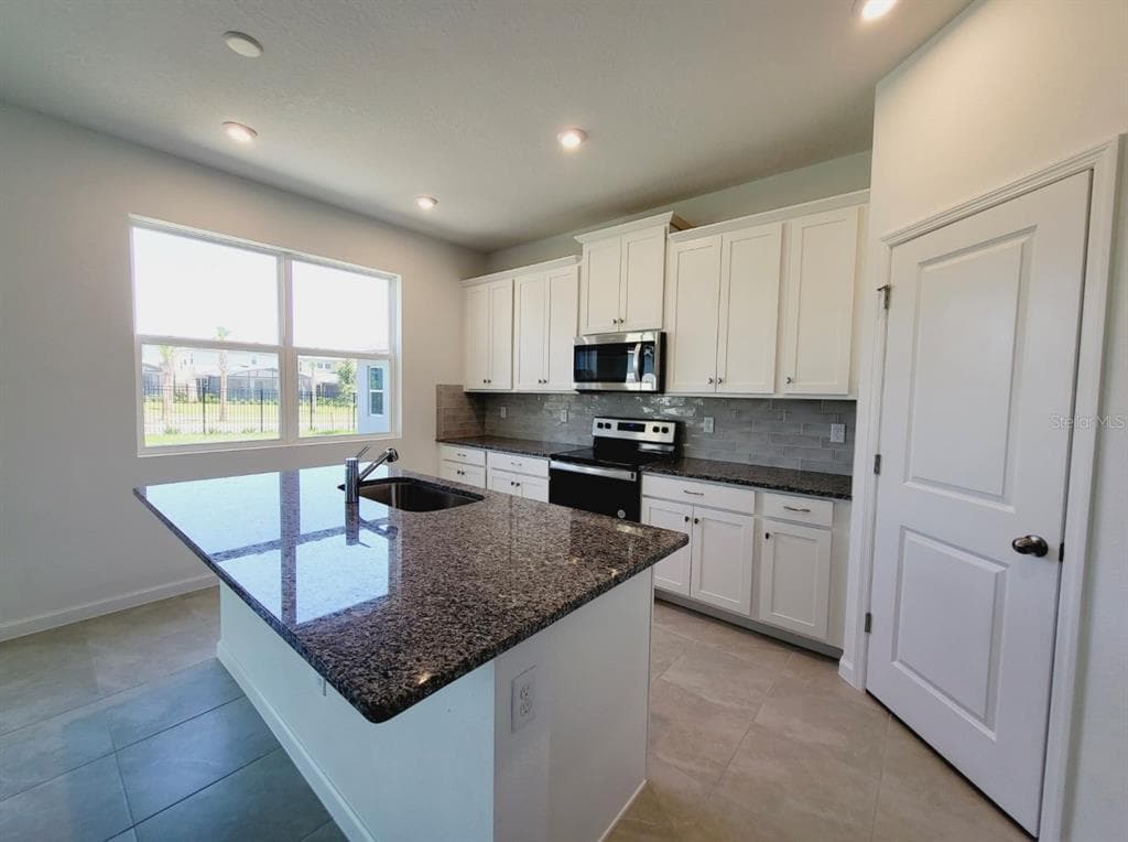 9051 CORAL CAPE STREET - Interior/Exterior Photo 4 - KISSIMMEE, FL